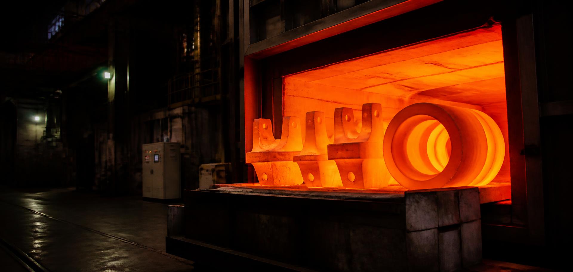 Forged nickel alloy components glowing inside a high-temperature furnace